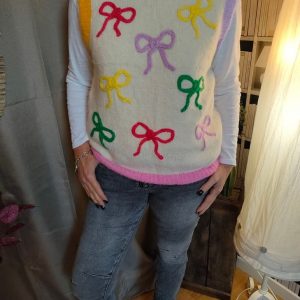 "Pull sans manches original avec nœuds colorés, parfait pour un style fun et tendance."